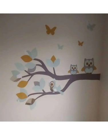 Behangsticker babykamer sierlijke uilentak mintgroen en okergeel.