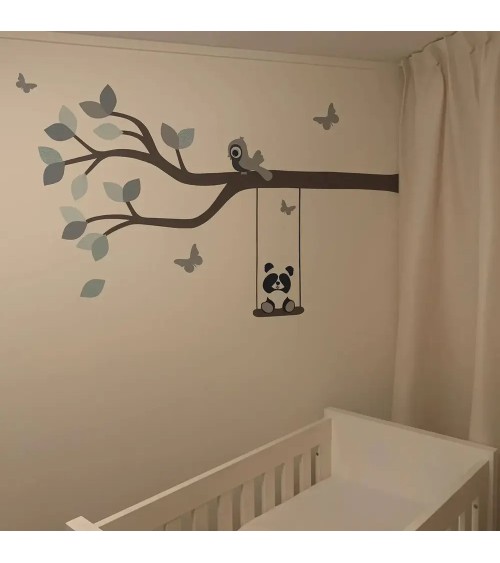 Behang muursticker babykamer losse sierlijke tak okergeel met indianen uil.