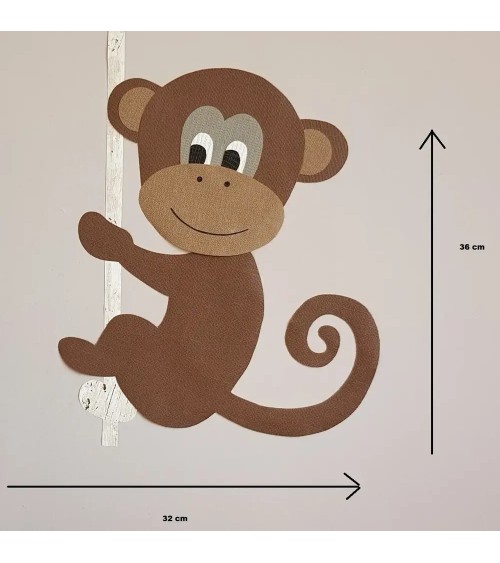 Behangsticker jungle kamer grote aap aan touw boven de commode.