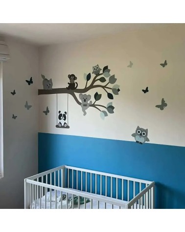 Behangsticker tak met dieren in een blauwe babykamer.