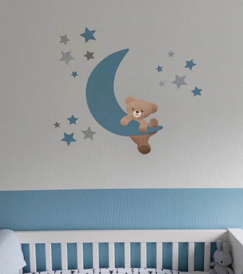 Behangsticker babykamer klimmende teddybeer op een okergele maan.