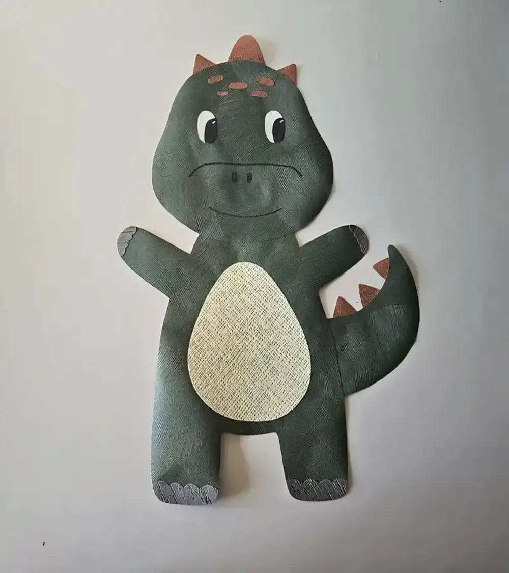 Schattige dino behangsticker voor de babykamer.