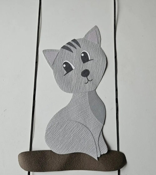 Behangsticker zittende poes op tak.