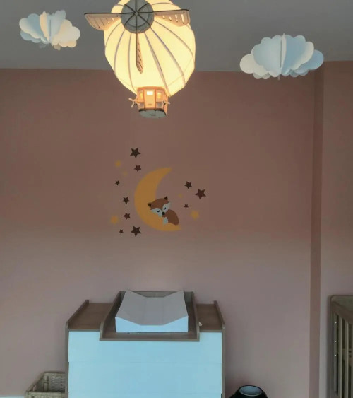 Behangsticker babykamer slapend vosje op de maan roest.