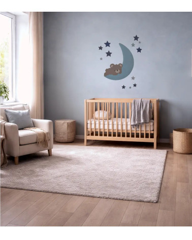 Behangsticker babykamer slapende teddybeer op de maan lichtblauw.
