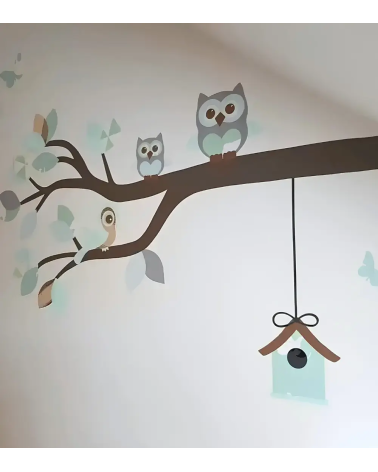 Sierlijke uilentak mintgroen behang muurdecoratie babykamer.
