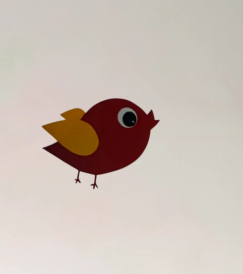 Behangsticker vliegend vogeltje rood, oker.