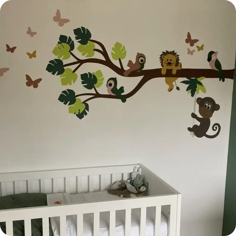 Behangsticker babykamer jungle tak met lieve jungle dieren